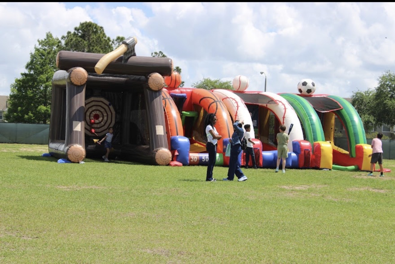 Sports interactive games and axe throwing inflatable at a school event